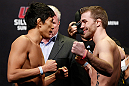 SAITAMA, JAPAN - MARCH 02: (L-R) Opponents Takeya Mizugaki and Bryan Caraway face off during the UFC on FUEL TV weigh-in at Saitama Super Arena on March 2, 2013 in Saitama, Japan. (Photo by Josh Hedges/Zuffa LLC/Zuffa LLC via Getty Images)