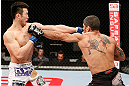 SAITAMA, JAPAN - MARCH 03:  (R-L) Marcelo Guimaraes and Hyun Gyu Lim trade punches in their welterweight fight during the UFC on FUEL TV event at Saitama Super Arena on March 3, 2013 in Saitama, Japan.  (Photo by Josh Hedges/Zuffa LLC/Zuffa LLC via Getty Images)