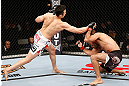 SAITAMA, JAPAN - MARCH 03:  (L-R) Hyun Gyu Lim punches Marcelo Guimaraes in their welterweight fight during the UFC on FUEL TV event at Saitama Super Arena on March 3, 2013 in Saitama, Japan.  (Photo by Josh Hedges/Zuffa LLC/Zuffa LLC via Getty Images)