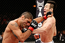 SAITAMA, JAPAN - MARCH 03:  (R-L) Hyun Gyu Lim and Marcelo Guimaraes trade punches in their welterweight fight during the UFC on FUEL TV event at Saitama Super Arena on March 3, 2013 in Saitama, Japan.  (Photo by Josh Hedges/Zuffa LLC/Zuffa LLC via Getty Images)