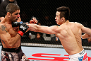 SAITAMA, JAPAN - MARCH 03:  (R-L) Hyun Gyu Lim punches Marcelo Guimaraes in their welterweight fight during the UFC on FUEL TV event at Saitama Super Arena on March 3, 2013 in Saitama, Japan.  (Photo by Josh Hedges/Zuffa LLC/Zuffa LLC via Getty Images)