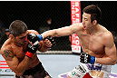 SAITAMA, JAPAN - MARCH 03:  (R-L) Hyun Gyu Lim punches Marcelo Guimaraes in their welterweight fight during the UFC on FUEL TV event at Saitama Super Arena on March 3, 2013 in Saitama, Japan.  (Photo by Josh Hedges/Zuffa LLC/Zuffa LLC via Getty Images)