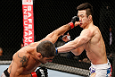 SAITAMA, JAPAN - MARCH 03:  (L-R) Marcelo Guimaraes punches Hyun Gyu Lim in their welterweight fight during the UFC on FUEL TV event at Saitama Super Arena on March 3, 2013 in Saitama, Japan.  (Photo by Josh Hedges/Zuffa LLC/Zuffa LLC via Getty Images)