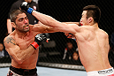 SAITAMA, JAPAN - MARCH 03:  (L-R) Marcelo Guimaraes punches Hyun Gyu Lim in their welterweight fight during the UFC on FUEL TV event at Saitama Super Arena on March 3, 2013 in Saitama, Japan.  (Photo by Josh Hedges/Zuffa LLC/Zuffa LLC via Getty Images)