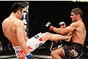SAITAMA, JAPAN - MARCH 03:  (L-R) Hyun Gyu Lim kicks Marcelo Guimaraes in their welterweight fight during the UFC on FUEL TV event at Saitama Super Arena on March 3, 2013 in Saitama, Japan.  (Photo by Josh Hedges/Zuffa LLC/Zuffa LLC via Getty Images)