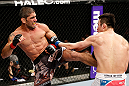 SAITAMA, JAPAN - MARCH 03:  (L-R) Marcelo Guimaraes kicks Hyun Gyu Lim in their welterweight fight during the UFC on FUEL TV event at Saitama Super Arena on March 3, 2013 in Saitama, Japan.  (Photo by Josh Hedges/Zuffa LLC/Zuffa LLC via Getty Images)