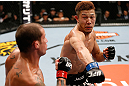 SAITAMA, JAPAN - MARCH 03:  (R-L) Kazuki Tokudome punches Cristiano Marcello in their lightweight fight during the UFC on FUEL TV event at Saitama Super Arena on March 3, 2013 in Saitama, Japan.  (Photo by Josh Hedges/Zuffa LLC/Zuffa LLC via Getty Images)