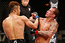 SAITAMA, JAPAN - MARCH 03:  (L-R) Kazuki Tokudome punches Cristiano Marcello in their lightweight fight during the UFC on FUEL TV event at Saitama Super Arena on March 3, 2013 in Saitama, Japan.  (Photo by Josh Hedges/Zuffa LLC/Zuffa LLC via Getty Images)