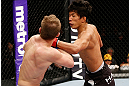 SAITAMA, JAPAN - MARCH 03:  (R-L) Takeya Mizugaki punches Bryan Caraway in their bantamweight fight during the UFC on FUEL TV event at Saitama Super Arena on March 3, 2013 in Saitama, Japan.  (Photo by Josh Hedges/Zuffa LLC/Zuffa LLC via Getty Images)