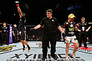 SAITAMA, JAPAN - MARCH 03:  Takeya Mizugaki (L) reacts after defeating Bryan Caraway in their bantamweight fight during the UFC on FUEL TV event at Saitama Super Arena on March 3, 2013 in Saitama, Japan.  (Photo by Josh Hedges/Zuffa LLC/Zuffa LLC via Getty Images)