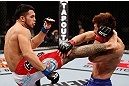SAITAMA, JAPAN - MARCH 03:  (L-R) Brad Tavares kicks Riki Fukuda in their middleweight fight during the UFC on FUEL TV event at Saitama Super Arena on March 3, 2013 in Saitama, Japan.  (Photo by Josh Hedges/Zuffa LLC/Zuffa LLC via Getty Images)