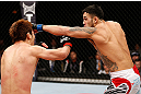 SAITAMA, JAPAN - MARCH 03:  (R-L) Brad Tavares punches Riki Fukuda in their middleweight fight during the UFC on FUEL TV event at Saitama Super Arena on March 3, 2013 in Saitama, Japan.  (Photo by Josh Hedges/Zuffa LLC/Zuffa LLC via Getty Images)