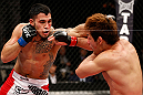 SAITAMA, JAPAN - MARCH 03:  (L-R) Brad Tavares punches Riki Fukuda in their middleweight fight during the UFC on FUEL TV event at Saitama Super Arena on March 3, 2013 in Saitama, Japan.  (Photo by Josh Hedges/Zuffa LLC/Zuffa LLC via Getty Images)