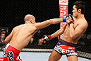 SAITAMA, JAPAN - MARCH 03:  (L-R) Siyar Bahadurzada punches Dong Hyun Kim in their welterweight fight during the UFC on FUEL TV event at Saitama Super Arena on March 3, 2013 in Saitama, Japan.  (Photo by Josh Hedges/Zuffa LLC/Zuffa LLC via Getty Images)