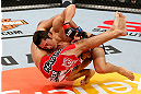 SAITAMA, JAPAN - MARCH 03:  (R-L) Dong Hyun Kim takes down Siyar Bahadurzada in their welterweight fight during the UFC on FUEL TV event at Saitama Super Arena on March 3, 2013 in Saitama, Japan.  (Photo by Josh Hedges/Zuffa LLC/Zuffa LLC via Getty Images)