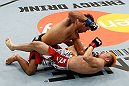 SAITAMA, JAPAN - MARCH 03:  (L-R) Rani Yahya punches Mizuto Hirota in their featherweight fight during the UFC on FUEL TV event at Saitama Super Arena on March 3, 2013 in Saitama, Japan.  (Photo by Josh Hedges/Zuffa LLC/Zuffa LLC via Getty Images)