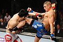 SAITAMA, JAPAN - MARCH 03:  (R-L) Diego Sanchez kicks Takanori Gomi in their lightweight fight during the UFC on FUEL TV event at Saitama Super Arena on March 3, 2013 in Saitama, Japan.  (Photo by Josh Hedges/Zuffa LLC/Zuffa LLC via Getty Images)