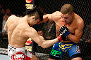 SAITAMA, JAPAN - MARCH 03:  (L-R) Takanori Gomi and Diego Sanchez trade punches in their lightweight fight during the UFC on FUEL TV event at Saitama Super Arena on March 3, 2013 in Saitama, Japan.  (Photo by Josh Hedges/Zuffa LLC/Zuffa LLC via Getty Images)