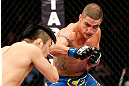SAITAMA, JAPAN - MARCH 03:  (R-L) Diego Sanchez punches Takanori Gomi in their lightweight fight during the UFC on FUEL TV event at Saitama Super Arena on March 3, 2013 in Saitama, Japan.  (Photo by Josh Hedges/Zuffa LLC/Zuffa LLC via Getty Images)
