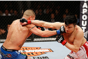 SAITAMA, JAPAN - MARCH 03:  (L-R) Diego Sanchez and Takanori Gomi trade punches in their lightweight fight during the UFC on FUEL TV event at Saitama Super Arena on March 3, 2013 in Saitama, Japan.  (Photo by Josh Hedges/Zuffa LLC/Zuffa LLC via Getty Images)