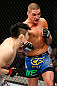 SAITAMA, JAPAN - MARCH 03:  (R-L) Diego Sanchez punches Takanori Gomi in their lightweight fight during the UFC on FUEL TV event at Saitama Super Arena on March 3, 2013 in Saitama, Japan.  (Photo by Josh Hedges/Zuffa LLC/Zuffa LLC via Getty Images)