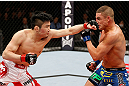 SAITAMA, JAPAN - MARCH 03:  (L-R) Takanori Gomi punches Diego Sanchez in their lightweight fight during the UFC on FUEL TV event at Saitama Super Arena on March 3, 2013 in Saitama, Japan.  (Photo by Josh Hedges/Zuffa LLC/Zuffa LLC via Getty Images)