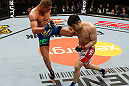 SAITAMA, JAPAN - MARCH 03:  (L-R) Diego Sanchez kicks Takanori Gomi in their lightweight fight during the UFC on FUEL TV event at Saitama Super Arena on March 3, 2013 in Saitama, Japan.  (Photo by Josh Hedges/Zuffa LLC/Zuffa LLC via Getty Images)