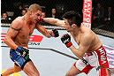 SAITAMA, JAPAN - MARCH 03:  (R-L) Takanori Gomi punches Diego Sanchez in their lightweight fight during the UFC on FUEL TV event at Saitama Super Arena on March 3, 2013 in Saitama, Japan.  (Photo by Josh Hedges/Zuffa LLC/Zuffa LLC via Getty Images)