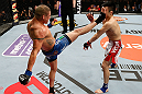 SAITAMA, JAPAN - MARCH 03:  (L-R) Diego Sanchez kicks Takanori Gomi in their lightweight fight during the UFC on FUEL TV event at Saitama Super Arena on March 3, 2013 in Saitama, Japan.  (Photo by Josh Hedges/Zuffa LLC/Zuffa LLC via Getty Images)