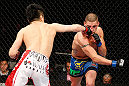 SAITAMA, JAPAN - MARCH 03:  (L-R) Takanori Gomi punches Diego Sanchez in their lightweight fight during the UFC on FUEL TV event at Saitama Super Arena on March 3, 2013 in Saitama, Japan.  (Photo by Josh Hedges/Zuffa LLC/Zuffa LLC via Getty Images)