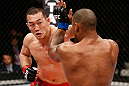 SAITAMA, JAPAN - MARCH 03:  (L-R) Yushin Okami punches Hector Lombard in their middleweight fight during the UFC on FUEL TV event at Saitama Super Arena on March 3, 2013 in Saitama, Japan.  (Photo by Josh Hedges/Zuffa LLC/Zuffa LLC via Getty Images)