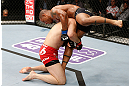 SAITAMA, JAPAN - MARCH 03:  (L-R) Yushin Okami takes down Hector Lombard in their middleweight fight during the UFC on FUEL TV event at Saitama Super Arena on March 3, 2013 in Saitama, Japan.  (Photo by Josh Hedges/Zuffa LLC/Zuffa LLC via Getty Images)