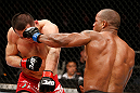 SAITAMA, JAPAN - MARCH 03:  (R-L) Hector Lombard punches Yushin Okami in their middleweight fight during the UFC on FUEL TV event at Saitama Super Arena on March 3, 2013 in Saitama, Japan.  (Photo by Josh Hedges/Zuffa LLC/Zuffa LLC via Getty Images)