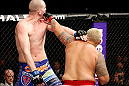 SAITAMA, JAPAN - MARCH 03:  (R-L) Mark Hunt punches Stefan Struve in their heavyweight fight during the UFC on FUEL TV event at Saitama Super Arena on March 3, 2013 in Saitama, Japan.  (Photo by Josh Hedges/Zuffa LLC/Zuffa LLC via Getty Images)