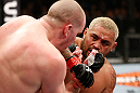 SAITAMA, JAPAN - MARCH 03:  (R-L) Mark Hunt punches Stefan Struve in their heavyweight fight during the UFC on FUEL TV event at Saitama Super Arena on March 3, 2013 in Saitama, Japan.  (Photo by Josh Hedges/Zuffa LLC/Zuffa LLC via Getty Images)