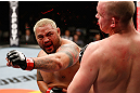SAITAMA, JAPAN - MARCH 03:  (L-R) Mark Hunt knocks out Stefan Struve with a punch in their heavyweight fight during the UFC on FUEL TV event at Saitama Super Arena on March 3, 2013 in Saitama, Japan.  (Photo by Josh Hedges/Zuffa LLC/Zuffa LLC via Getty Images)