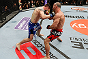 SAITAMA, JAPAN - MARCH 03:  (R-L) Wanderlei Silva and Brian Stann trade puncehs in their light heavyweight fight during the UFC on FUEL TV event at Saitama Super Arena on March 3, 2013 in Saitama, Japan.  (Photo by Josh Hedges/Zuffa LLC/Zuffa LLC via Getty Images)