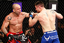 SAITAMA, JAPAN - MARCH 03:  (L-R) Wanderlei Silva punches Brian Stann in their light heavyweight fight during the UFC on FUEL TV event at Saitama Super Arena on March 3, 2013 in Saitama, Japan.  (Photo by Josh Hedges/Zuffa LLC/Zuffa LLC via Getty Images)