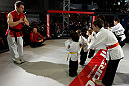 MONTREAL, QC - MARCH 13:  UFC welterweight champion Georges St-Pierre (2L) watches a demonstration by students of the Sunfuki Karate school during the UFC 158 open workouts at Complexe Desjardins on March 13, 2013 in Montreal, Quebec, Canada.  (Photo by Josh Hedges/Zuffa LLC/Zuffa LLC via Getty Images)