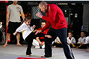 MONTREAL, QC - MARCH 13:  UFC welterweight champion Georges St-Pierre (R) spars with students of the Sunfuki Karate school during the UFC 158 open workouts at Complexe Desjardins on March 13, 2013 in Montreal, Quebec, Canada.  (Photo by Josh Hedges/Zuffa LLC/Zuffa LLC via Getty Images)