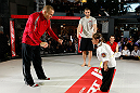 MONTREAL, QC - MARCH 13:  UFC welterweight champion Georges St-Pierre (L) spars with students of the Sunfuki Karate school during the UFC 158 open workouts at Complexe Desjardins on March 13, 2013 in Montreal, Quebec, Canada.  (Photo by Josh Hedges/Zuffa LLC/Zuffa LLC via Getty Images)