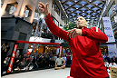 MONTREAL, QC - MARCH 13:  UFC welterweight champion Georges St-Pierre tosses autographed DVD's into the crowd during the UFC 158 open workouts at Complexe Desjardins on March 13, 2013 in Montreal, Quebec, Canada.  (Photo by Josh Hedges/Zuffa LLC/Zuffa LLC via Getty Images)