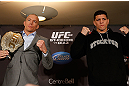 MONTREAL, QC - MARCH 14:  (L-R) Opponents Georges St-Pierre and Nick Diaz pose for photos during the final press conference ahead of his UFC 158 bout at Bell Centre on March 14, 2013 in Montreal, Quebec, Canada.  (Photo by Josh Hedges/Zuffa LLC/Zuffa LLC via Getty Images)