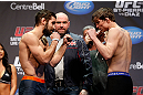 MONTREAL, QC - MARCH 15:  (L-R) Antonio Carvalho faces off with Darren Elkins during the UFC 158 weigh-in at Bell Centre on March 15, 2013 in Montreal, Quebec, Canada.  (Photo by Josh Hedges/Zuffa LLC/Zuffa LLC via Getty Images)