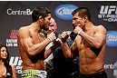 MONTREAL, QC - MARCH 15: (L-R) Patrick Cote faces off with Bobby Voelker during the UFC 158 weigh-in at Bell Centre on March 15, 2013 in Montreal, Quebec, Canada.  (Photo by Josh Hedges/Zuffa LLC/Zuffa LLC via Getty Images)