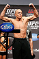 MONTREAL, QC - MARCH 15:  Georges St-Pierre raises his arms during the UFC 158 weigh-in at Bell Centre on March 15, 2013 in Montreal, Quebec, Canada.  (Photo by Josh Hedges/Zuffa LLC/Zuffa LLC via Getty Images)