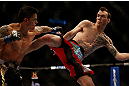 MONTREAL, QC - MARCH 16: George Roop lands a kick against Reuben Duran in their bantamweight bout during the UFC 158 event at Bell Centre on March 16, 2013 in Montreal, Quebec, Canada.  (Photo by Josh Hedges/Zuffa LLC/Zuffa LLC via Getty Images)