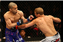 MONTREAL, QC - MARCH 16:  (R-L) T.J. Dillashaw lands a punch on Issei Tamura in their bantamweight bout during the UFC 158 event at Bell Centre on March 16, 2013 in Montreal, Quebec, Canada.  (Photo by Jonathan Ferrey/Zuffa LLC/Zuffa LLC via Getty Images)