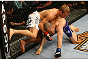 MONTREAL, QC - MARCH 16:  (L-R) T.J. Dillashaw grapples with Issei Tamura in their bantamweight bout during the UFC 158 event at Bell Centre on March 16, 2013 in Montreal, Quebec, Canada.  (Photo by Jonathan Ferrey/Zuffa LLC/Zuffa LLC via Getty Images)