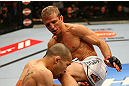 MONTREAL, QC - MARCH 16:  T.J. Dillashaw knees Issei Tamura in their bantamweight bout during the UFC 158 event at Bell Centre on March 16, 2013 in Montreal, Quebec, Canada.  (Photo by Jonathan Ferrey/Zuffa LLC/Zuffa LLC via Getty Images)